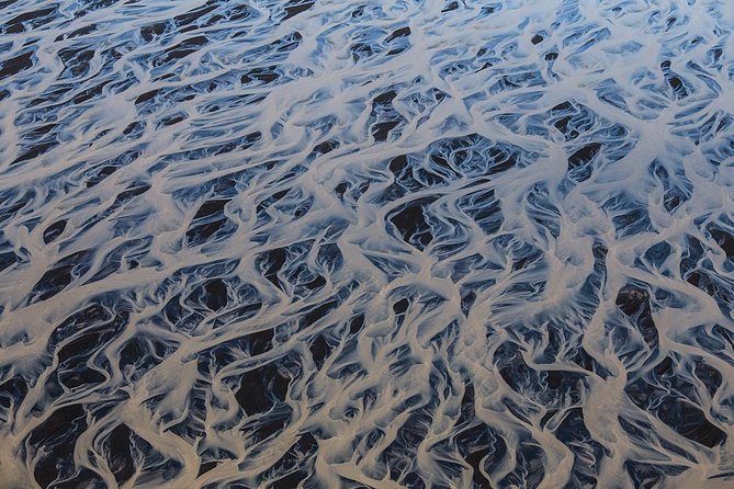 Airplane tour over black sands and riverbeds from Skaftafell - Skeiðarársandur glacier views you can actually spot