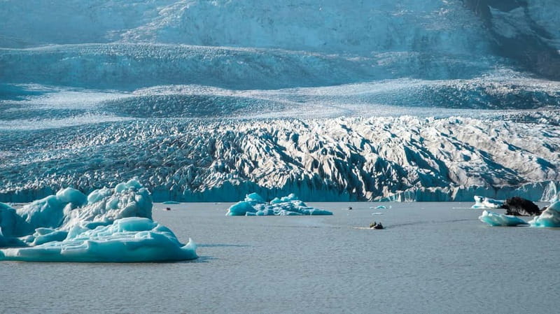 Fjallsárlón: Secluded Glacier Hike and Iceberg Boat Tour - Zodiac boat cruise on Fjallsárlón: icebergs, calm water, and real time