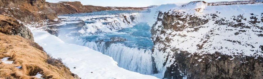 From Reykjavik: Golden Circle & Secret Lagoon Day Tour - Geysir area: Faxi waterfall, bubbling ground, and watching Strokkur