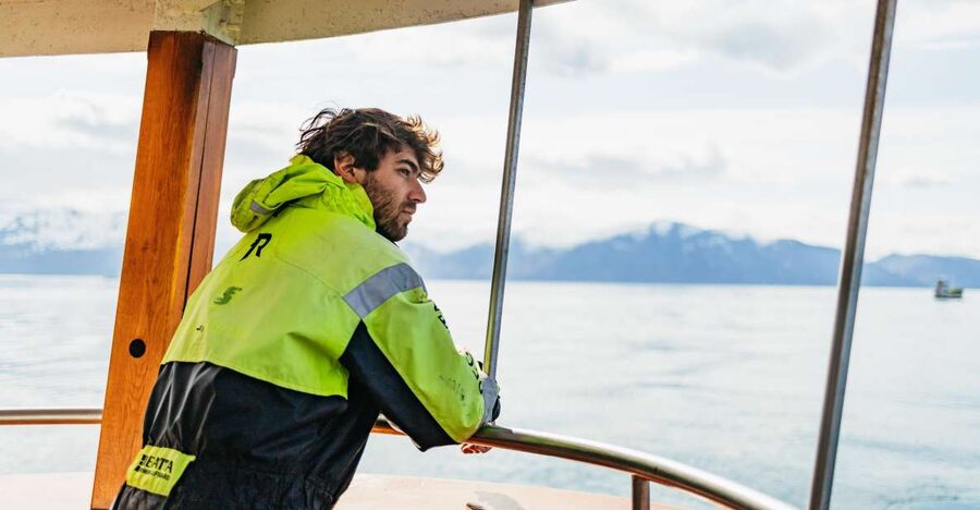 Húsavík: Whale Watching Tour with Guide - The boat ride setup: traditional oak, warm overalls, and real viewing space