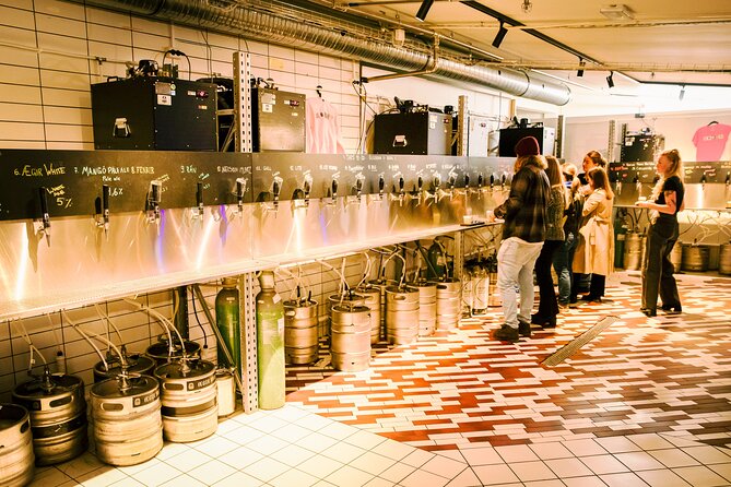 Reykjavík All In One Food Tour - Eat, Drink & Explore with Locals - Walking by the rainbow street and the statue moment