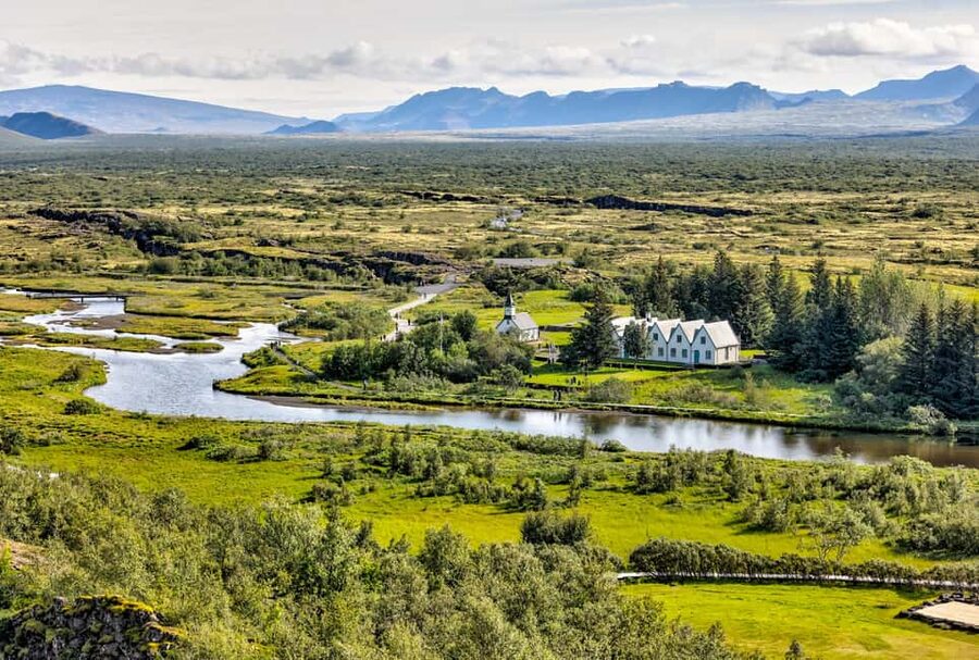 Reykjavík: Golden Circle & Extra Waterfalls Small Group Tour - Kerið crater: red slopes, teal blue water, and a short walking loop