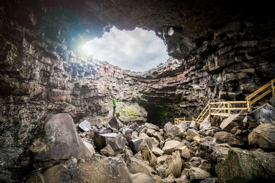 Reykjavik: Lava Cave, Hot Springs, Horses & Waterfalls Tour - Stepping into Viðgelmir Lava Cave: cold colors and a wet, careful walk