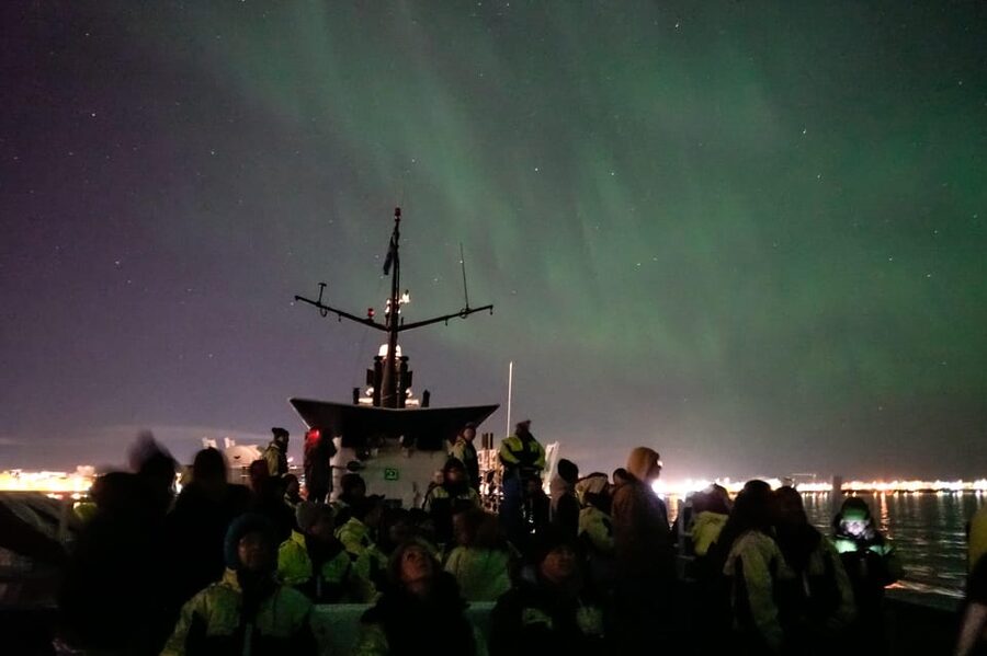 Reykjavik: Northern Lights Guided Boat Tour with Photos - Warm overalls, café stops, Wi-Fi, and the onboard video plan