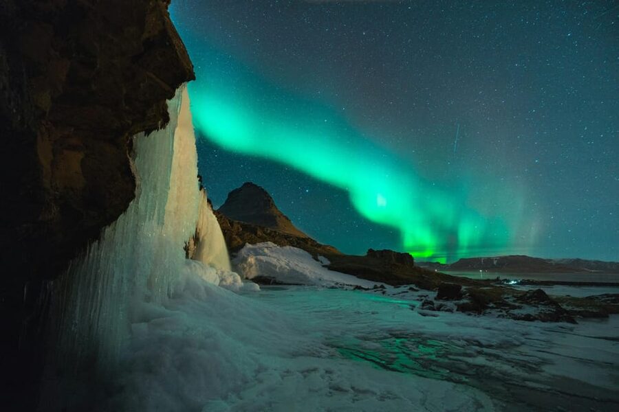 Reykjavik: Small-Group Northern Lights Tour with Pickup - How the guide hunts for clear skies and aurora activity