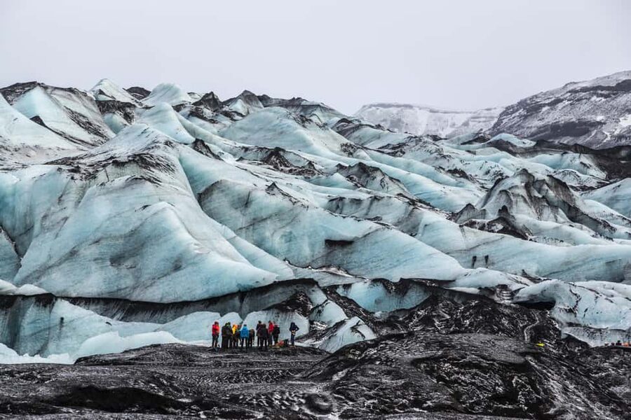 Reykjavik: South Coast, Glacier Hike & Northern Lights Combo - Sólheimajökull glacier hike: gear up, then watch the ice move