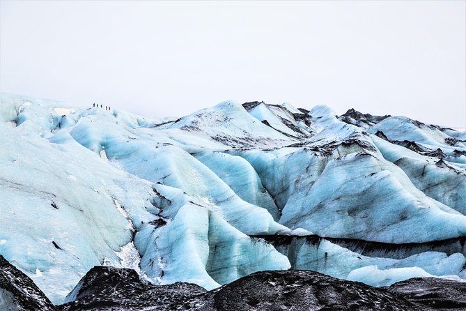 Reykjavik: South Coast, Waterfalls & Glacier Hike Small-Group - Reynisfjara Black Sand Beach: Basalt Columns and Sneaker Wave Warning