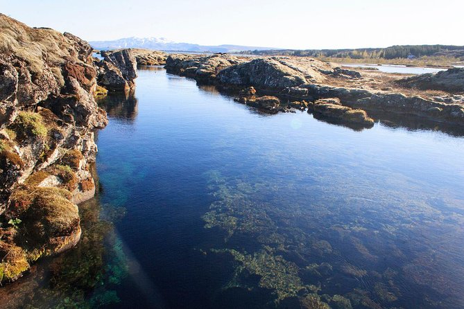 Silfra Drysuit Snorkeling with Free Photos - Meet on Location - Wetsuit vs dry suit option in the same day structure