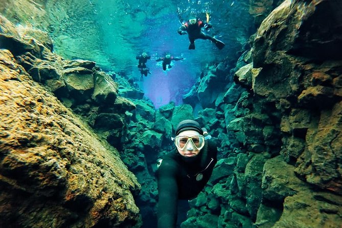 Silfra Wetsuit Snorkeling - Meet on Location | Free Photos - Drysuit vs Wetsuit: Warmth, Buoyancy, and Comfort Tradeoffs