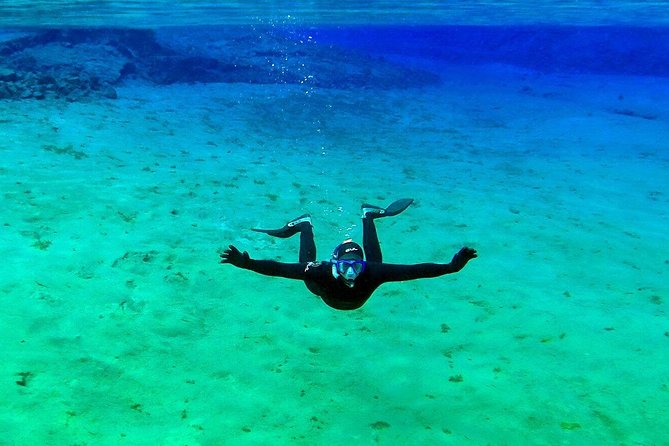 Silfra Wetsuit Snorkeling Tour with Underwater Photos - From Reykjavik - Cold reality check, plus how to stay comfortable
